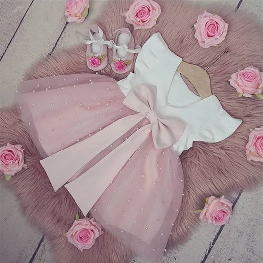 Vestido com Laço Rosa - 9 meses a 5 anos